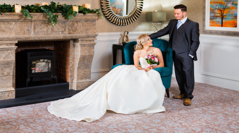 Guest Lounge Area Fire Place With Wedding Couple
